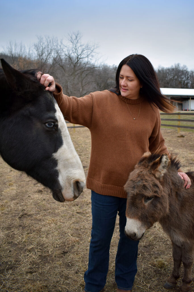 therapist with a horse and donkey